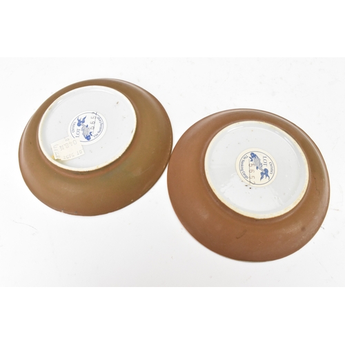 54 - Two Chinese Export Nanking Cargo cafe-au-lait blue and white tea bowls and saucers, Qianlong, mid 18... 