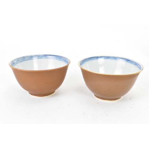 54 - Two Chinese Export Nanking Cargo cafe-au-lait blue and white tea bowls and saucers, Qianlong, mid 18... 