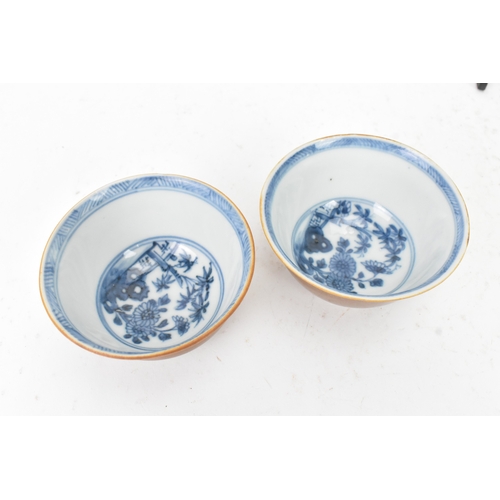 54 - Two Chinese Export Nanking Cargo cafe-au-lait blue and white tea bowls and saucers, Qianlong, mid 18... 