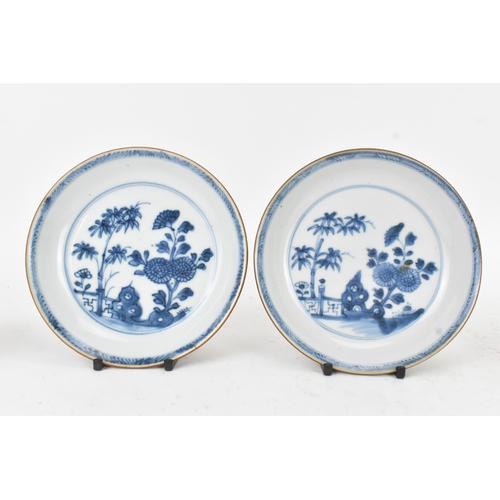 56 - Two Chinese Export Nanking Cargo cafe-au-lait blue and white tea bowls and saucers, Qianlong, mid 18... 