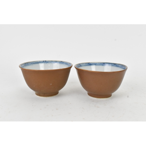 56 - Two Chinese Export Nanking Cargo cafe-au-lait blue and white tea bowls and saucers, Qianlong, mid 18... 