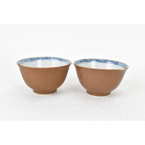 56 - Two Chinese Export Nanking Cargo cafe-au-lait blue and white tea bowls and saucers, Qianlong, mid 18... 