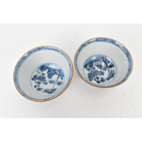 56 - Two Chinese Export Nanking Cargo cafe-au-lait blue and white tea bowls and saucers, Qianlong, mid 18... 