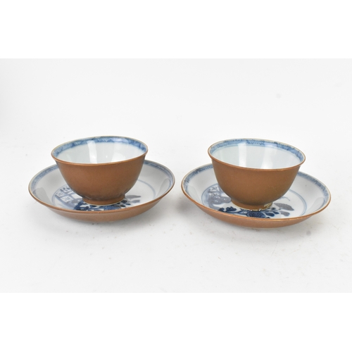 56 - Two Chinese Export Nanking Cargo cafe-au-lait blue and white tea bowls and saucers, Qianlong, mid 18... 