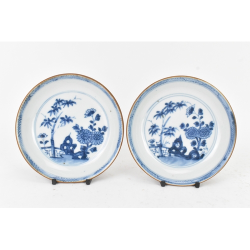 57 - Two Chinese Export Nanking Cargo cafe-au-lait blue and white tea bowls and saucers, Qianlong, mid 18... 