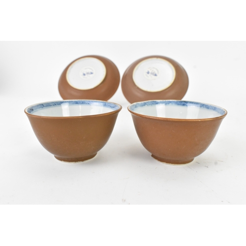 57 - Two Chinese Export Nanking Cargo cafe-au-lait blue and white tea bowls and saucers, Qianlong, mid 18... 