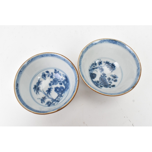 57 - Two Chinese Export Nanking Cargo cafe-au-lait blue and white tea bowls and saucers, Qianlong, mid 18... 