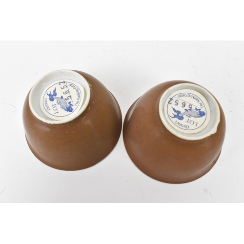 57 - Two Chinese Export Nanking Cargo cafe-au-lait blue and white tea bowls and saucers, Qianlong, mid 18... 
