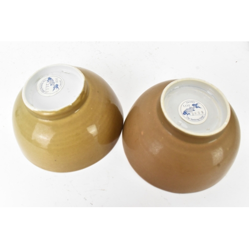 58 - Two Chinese Export Nanking Cargo cafe-au-lait blue and white bowls, Qianlong, mid 18th century, each... 