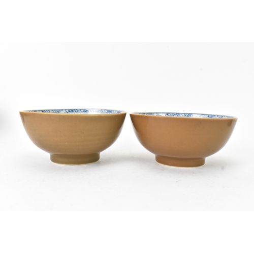 59 - Two Chinese Export Nanking Cargo cafe-au-lait blue and white bowls, Qianlong, mid 18th century, each... 