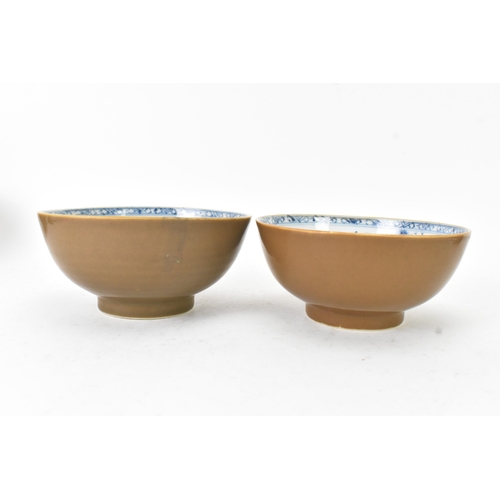 59 - Two Chinese Export Nanking Cargo cafe-au-lait blue and white bowls, Qianlong, mid 18th century, each... 