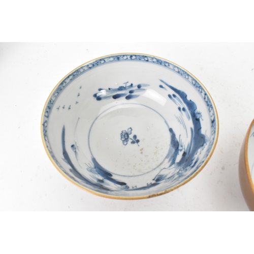 59 - Two Chinese Export Nanking Cargo cafe-au-lait blue and white bowls, Qianlong, mid 18th century, each... 