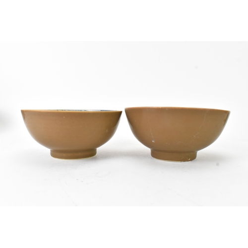 60 - Two Chinese Export Nanking Cargo cafe-au-lait blue and white bowls, Qianlong, mid 18th century, each... 