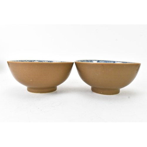 60 - Two Chinese Export Nanking Cargo cafe-au-lait blue and white bowls, Qianlong, mid 18th century, each... 