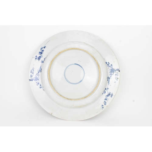 9 - A Chinese Qing dynasty blue and white porcelain charger, 18th century, the centre decorated with a r... 