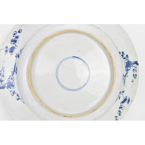 9 - A Chinese Qing dynasty blue and white porcelain charger, 18th century, the centre decorated with a r... 