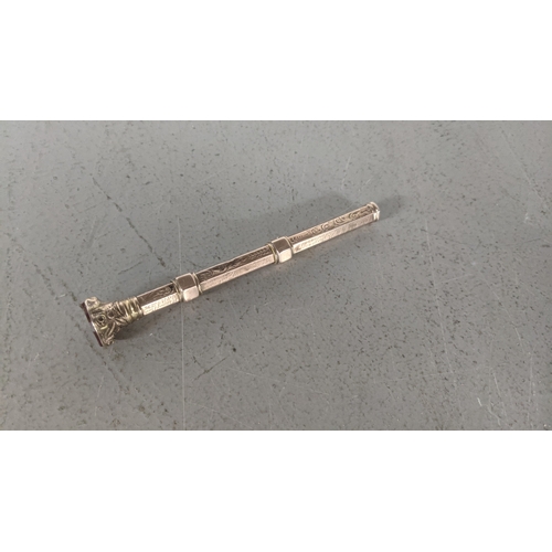 40 - A Victorian rose coloured metal cased vintage propelling pen with gold plated sliders and engraving ... 