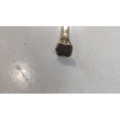 41 - A vintage propelling pencil with an engine turned design the case testing as 9ct gold weighing a tot... 