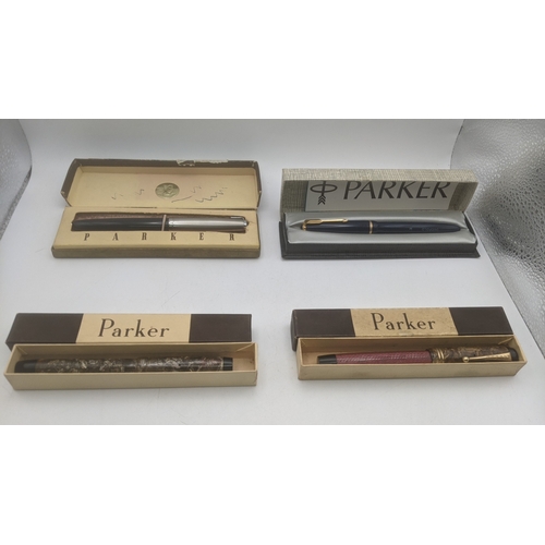 46 - A group of four boxed vintage Parker pens to include Duofold with a 14ct gold nib, a Parker Victory ... 