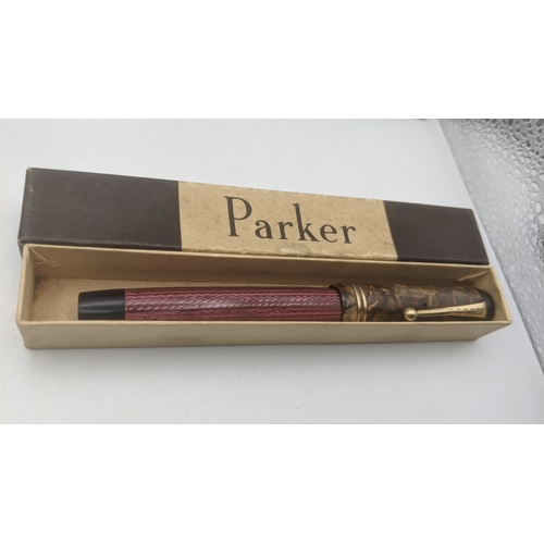 46 - A group of four boxed vintage Parker pens to include Duofold with a 14ct gold nib, a Parker Victory ... 