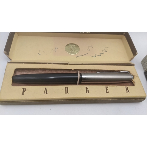 46 - A group of four boxed vintage Parker pens to include Duofold with a 14ct gold nib, a Parker Victory ... 