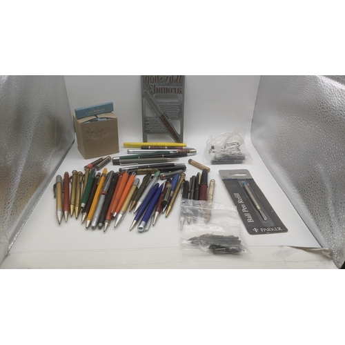 48 - A large collection of writing equipment to include four Superite gold plated propelling pencils, a P... 