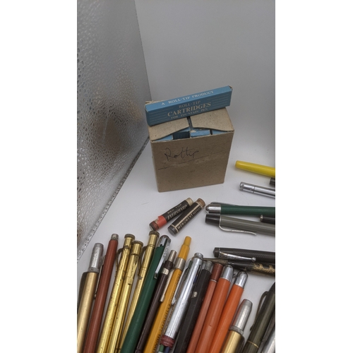 48 - A large collection of writing equipment to include four Superite gold plated propelling pencils, a P... 