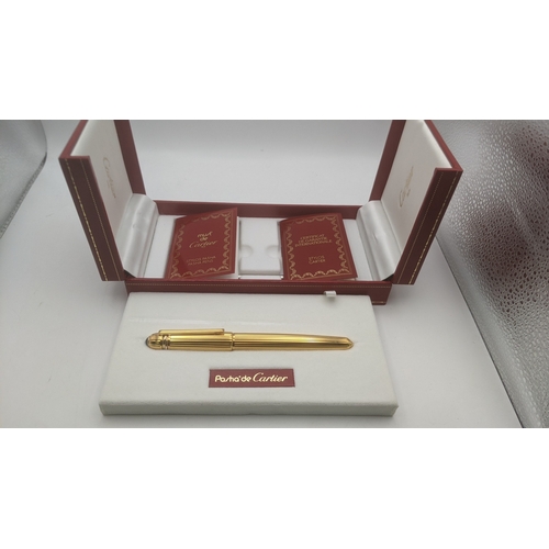 50 - An unused Pasha de Cartier gold plated ballpoint pen circa 1991 no 06303 with box, guarantee user gu... 
