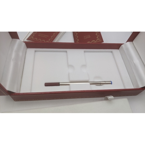 50 - An unused Pasha de Cartier gold plated ballpoint pen circa 1991 no 06303 with box, guarantee user gu... 
