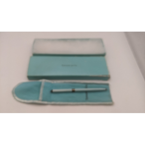 52 - A Tiffany and Co turquoise cased ballpoint pen with a silver band with a branded box and sleeve
Loca... 