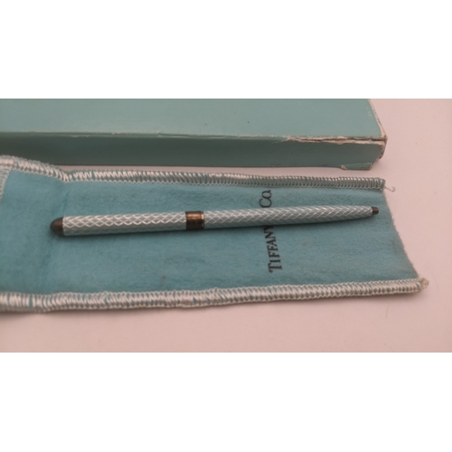 52 - A Tiffany and Co turquoise cased ballpoint pen with a silver band with a branded box and sleeve
Loca... 