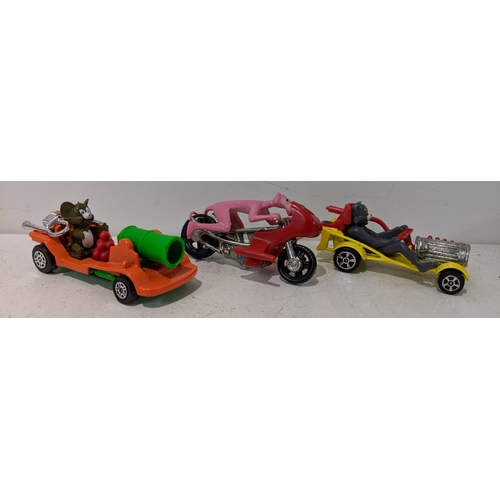 218 - Corgi to include Tom & Jerry vehicles, a Pink Panther on a bike and three yellow Citroen 2CVs from t... 