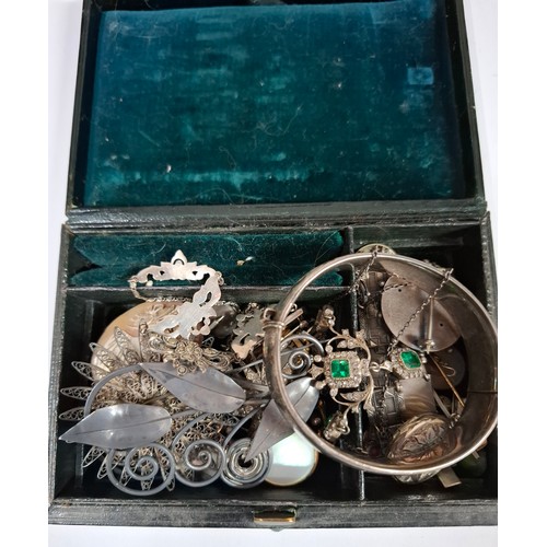 40 - A small Victorian leather jewellery box and contents to include early 20th Century silver and white ... 