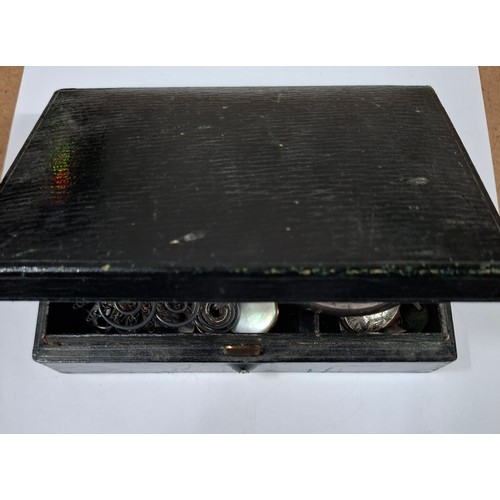 40 - A small Victorian leather jewellery box and contents to include early 20th Century silver and white ... 