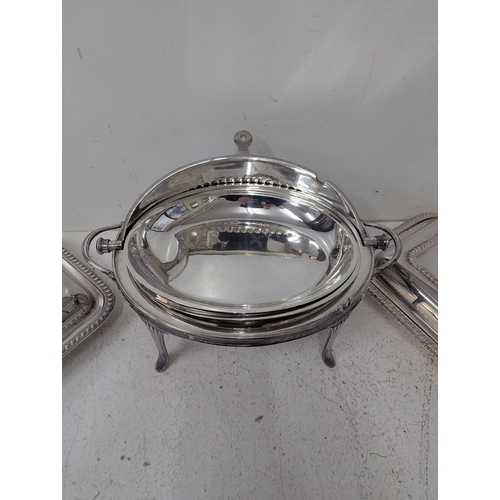 387 - Silver plated items to include a roll-top serving dish having a ribbed dome lid, twin handles on fou... 