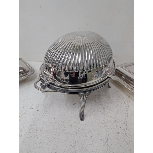 387 - Silver plated items to include a roll-top serving dish having a ribbed dome lid, twin handles on fou... 