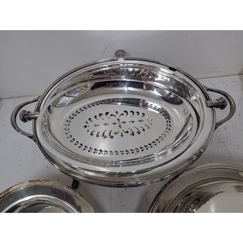 441 - Silver plated items to include a roll-top serving dish having a ribbed dome revolving lid on curved ... 