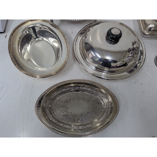 441 - Silver plated items to include a roll-top serving dish having a ribbed dome revolving lid on curved ... 