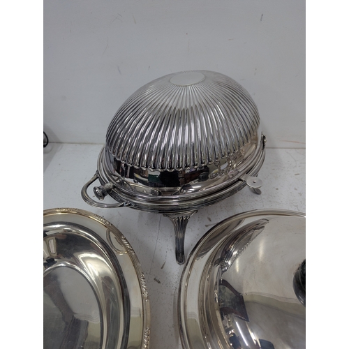 441 - Silver plated items to include a roll-top serving dish having a ribbed dome revolving lid on curved ... 