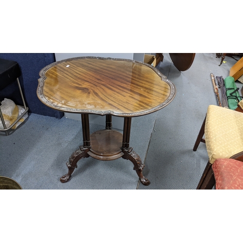 470 - A Georgian inspired early 20th century mahogany occasional table having a shaped top, turned columns... 