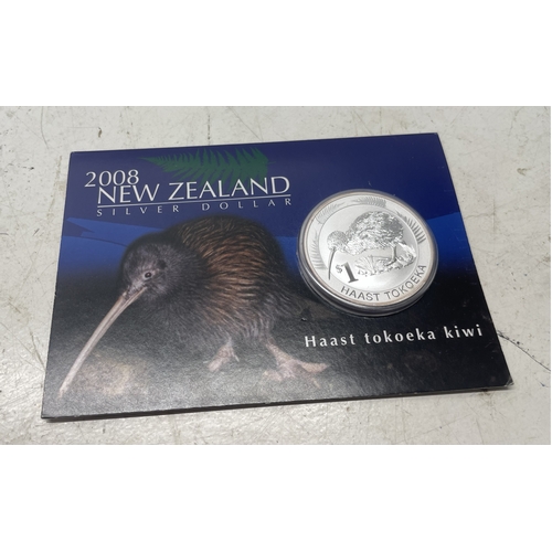 20 - A collection of five New Zealand $1 silver coins in presentation packs and a 1998 New Zealand $10 wi... 