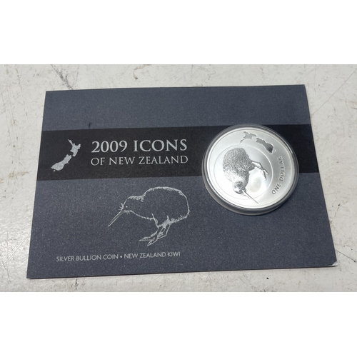 33 - A collection of seven New Zealand $1 silver coins in presentation packs, combined weight of coins 20... 