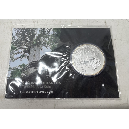 33 - A collection of seven New Zealand $1 silver coins in presentation packs, combined weight of coins 20... 