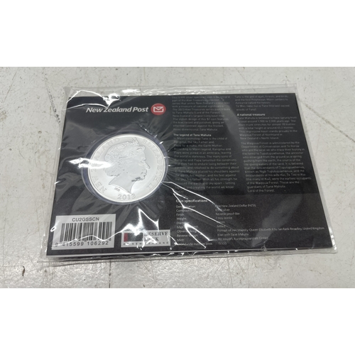 33 - A collection of seven New Zealand $1 silver coins in presentation packs, combined weight of coins 20... 
