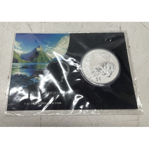 33 - A collection of seven New Zealand $1 silver coins in presentation packs, combined weight of coins 20... 