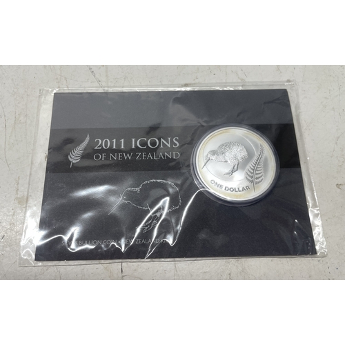33 - A collection of seven New Zealand $1 silver coins in presentation packs, combined weight of coins 20... 