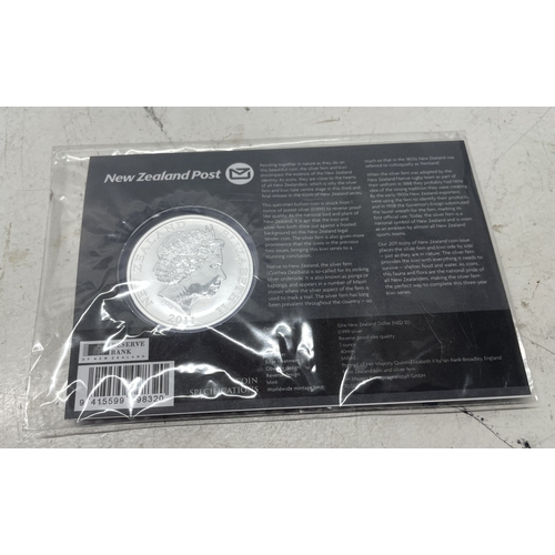 33 - A collection of seven New Zealand $1 silver coins in presentation packs, combined weight of coins 20... 