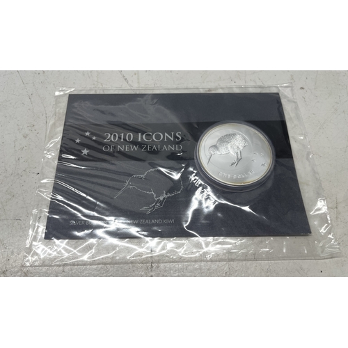33 - A collection of seven New Zealand $1 silver coins in presentation packs, combined weight of coins 20... 