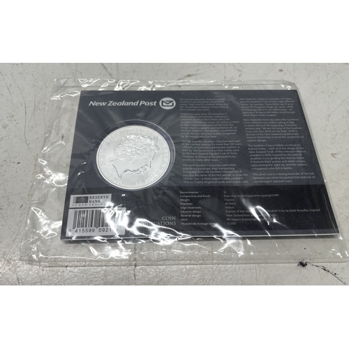 33 - A collection of seven New Zealand $1 silver coins in presentation packs, combined weight of coins 20... 