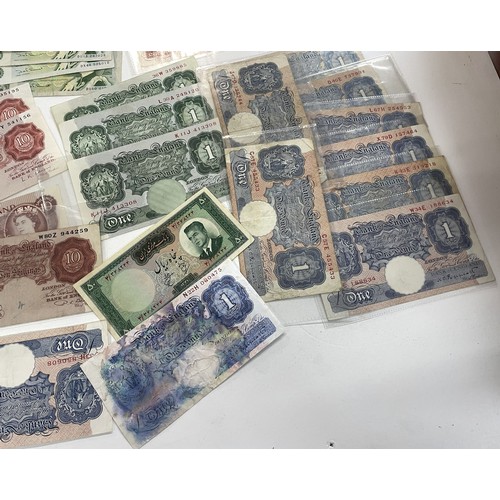 13A - A large collection of mainly British bank notes to include 10 Shilling notes, £1 Pound notes and £5 ... 